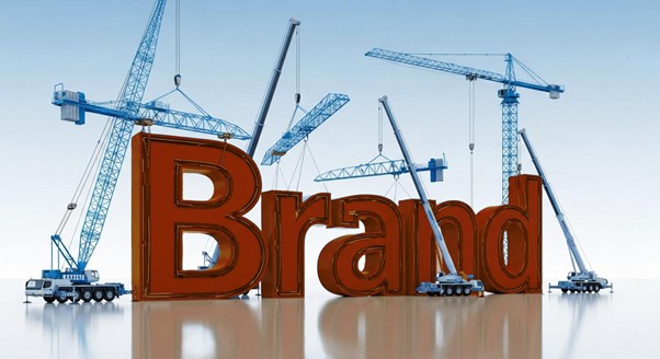 Illustration of a business professional reviewing blueprints and multiple data charts, symbolizing meticulous strategic planning and measurement.